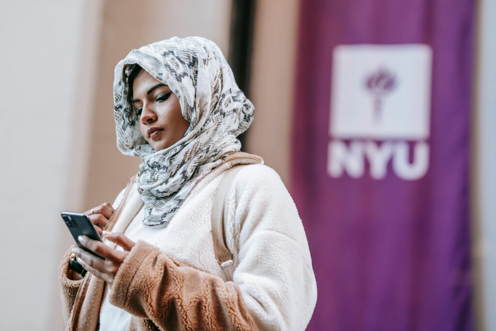 A female student wearing Hijab and long sleeve sweater