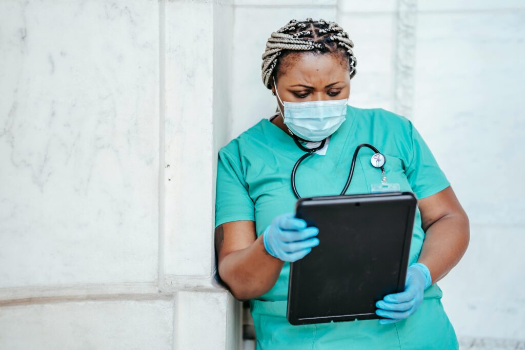 A focused female nurse with documents in hospital