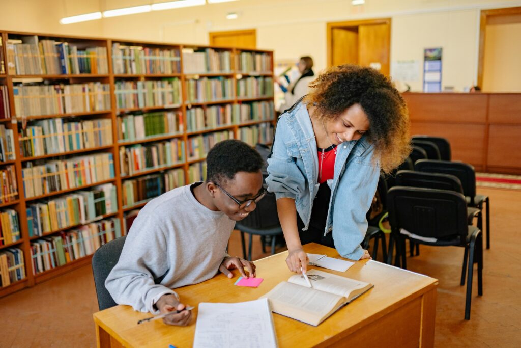 Male and female students Studying Inside the Library