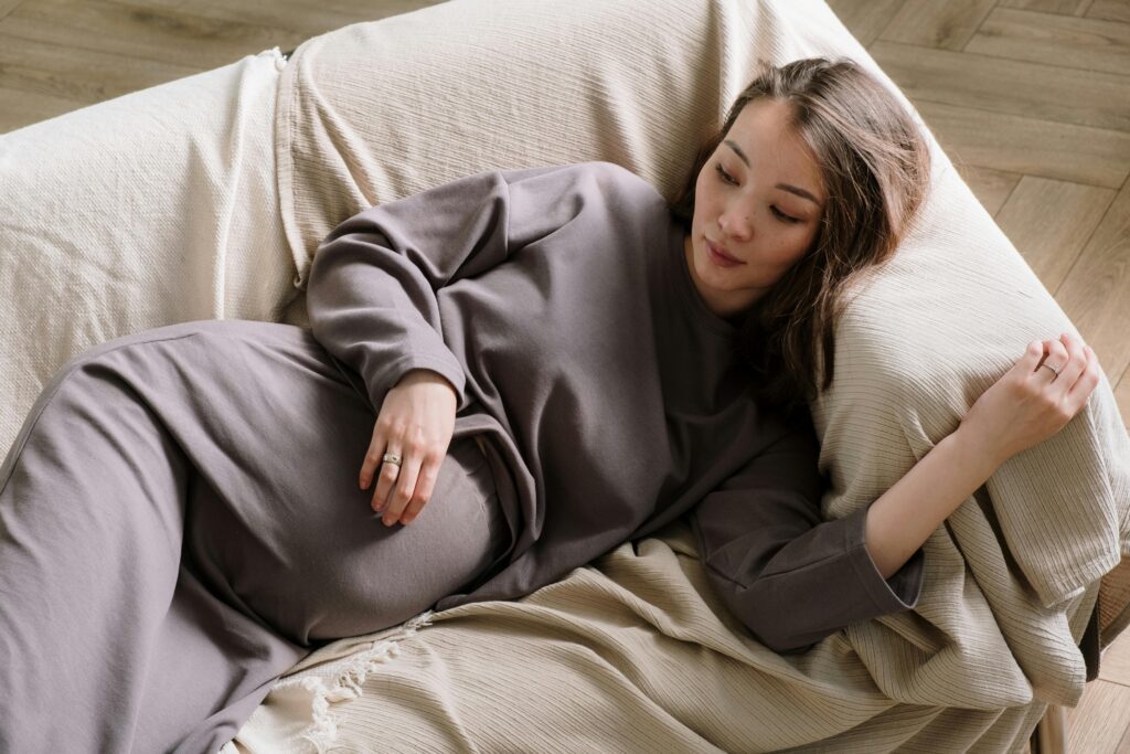A Pregnant Woman Lying on a Couch