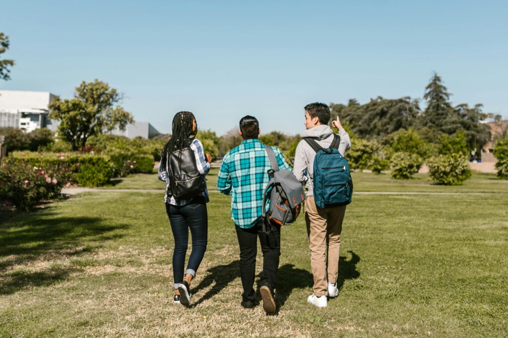 College students walking in the school field heading to the classroom