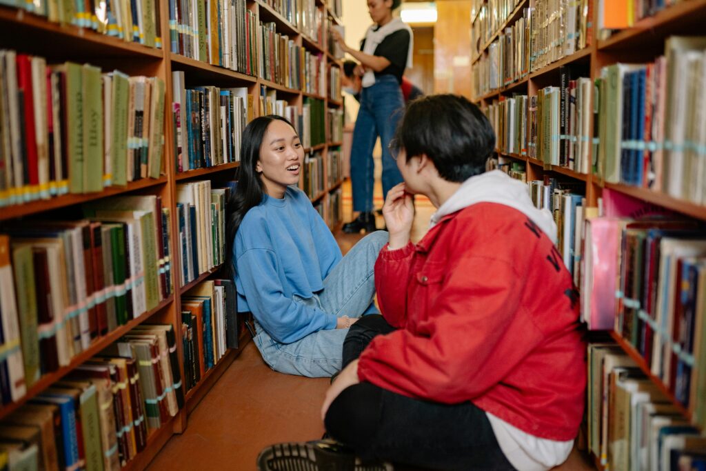 College Friends Sitting in the Library